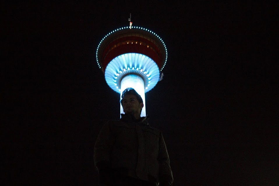 Calgary Tower Night Shot from the base, lit up with blue lights